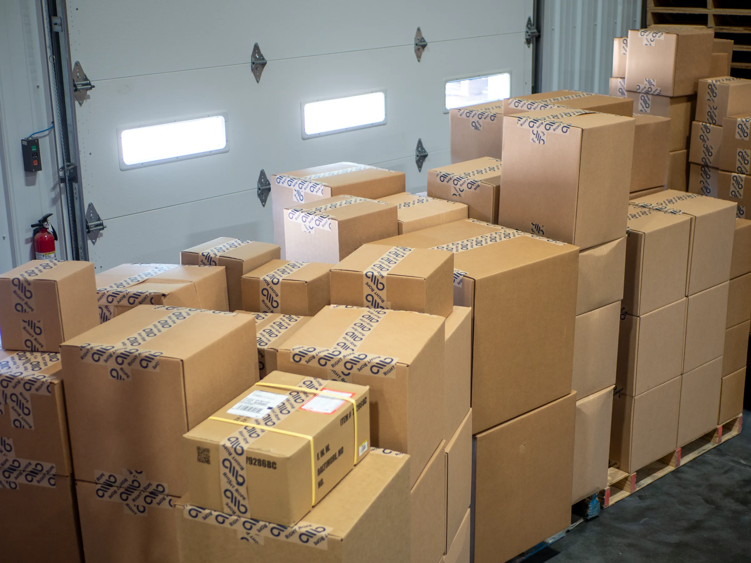 Packages shipped in front of overhead door